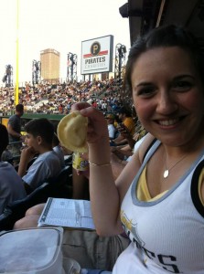 Kerri at a Pirates game with one of her favorite "Pittsburgh" foods - a pierogi!